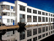 Image of art deco building reflected in river arrt print